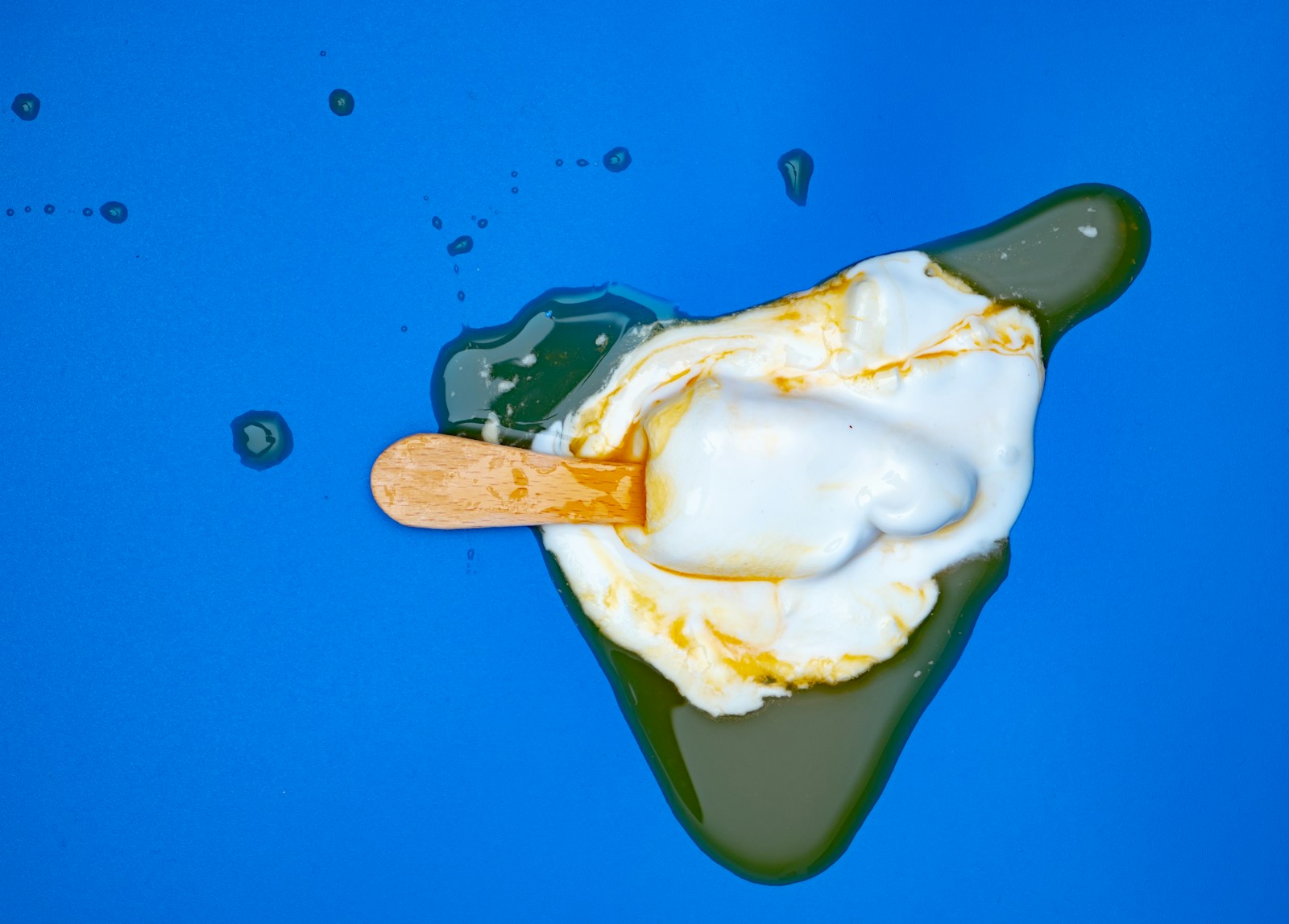 a scoop of ice cream sitting on top of a blue surface
